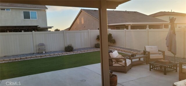 view of patio terrace at dusk