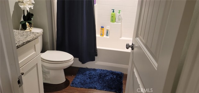 full bathroom featuring vanity, hardwood / wood-style floors, toilet, and shower / bath combo with shower curtain