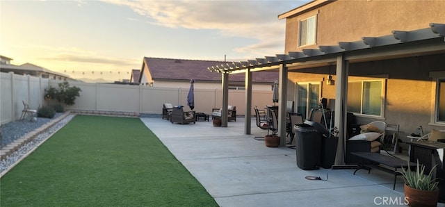 patio terrace at dusk featuring an outdoor fire pit