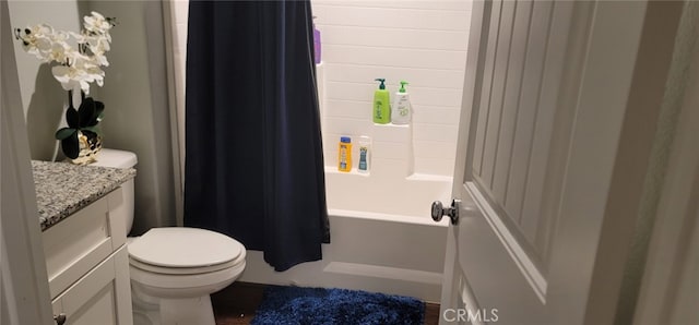 full bathroom featuring vanity, shower / bathtub combination with curtain, and toilet