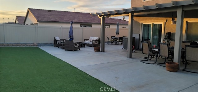 view of patio terrace at dusk