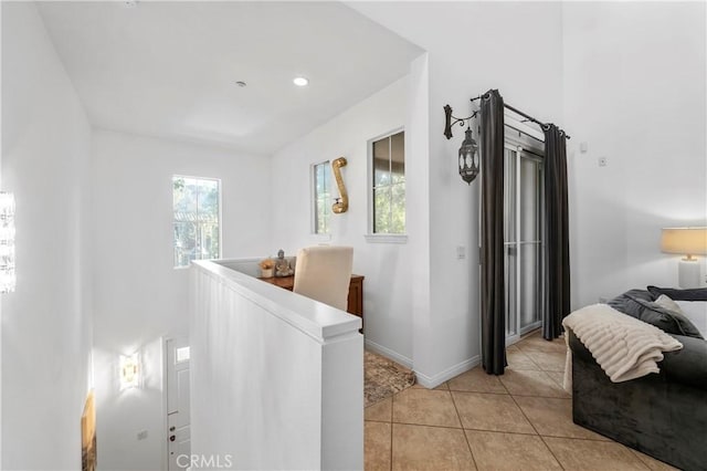 hallway featuring light tile patterned flooring