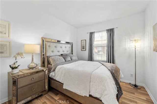 bedroom with light wood-type flooring