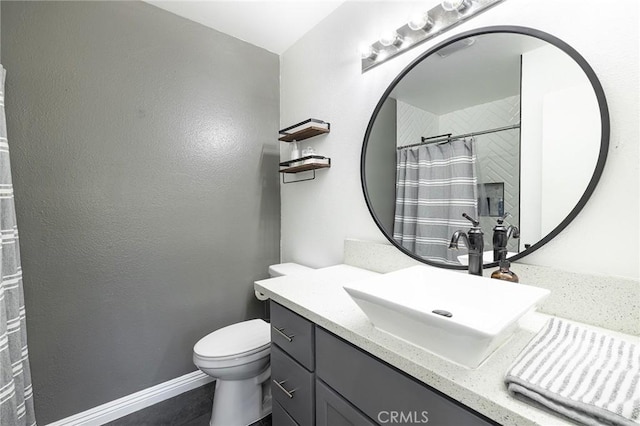 bathroom with toilet and vanity