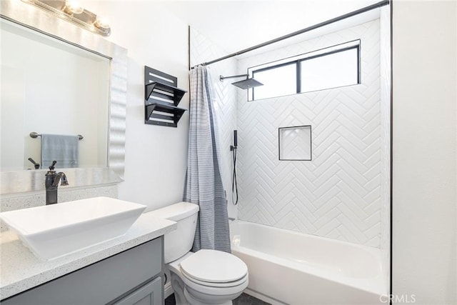 full bathroom featuring toilet, vanity, and shower / bath combo with shower curtain