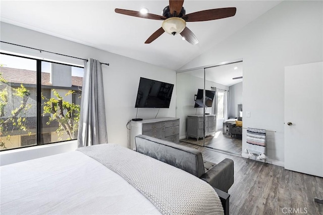 bedroom featuring lofted ceiling, hardwood / wood-style floors, a closet, and ceiling fan