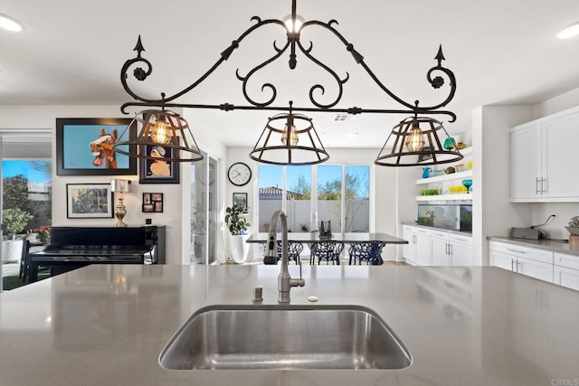 kitchen with white cabinetry and sink