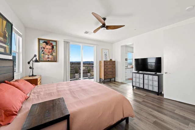 bedroom with access to exterior, hardwood / wood-style floors, and ceiling fan