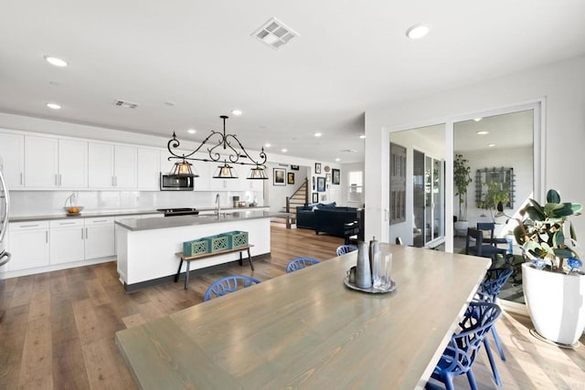 dining space featuring hardwood / wood-style floors