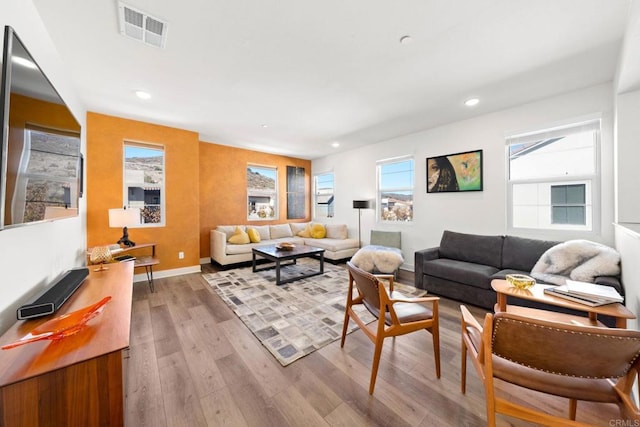 living room with light hardwood / wood-style floors