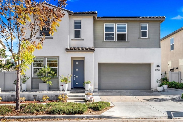 mediterranean / spanish-style home with a garage