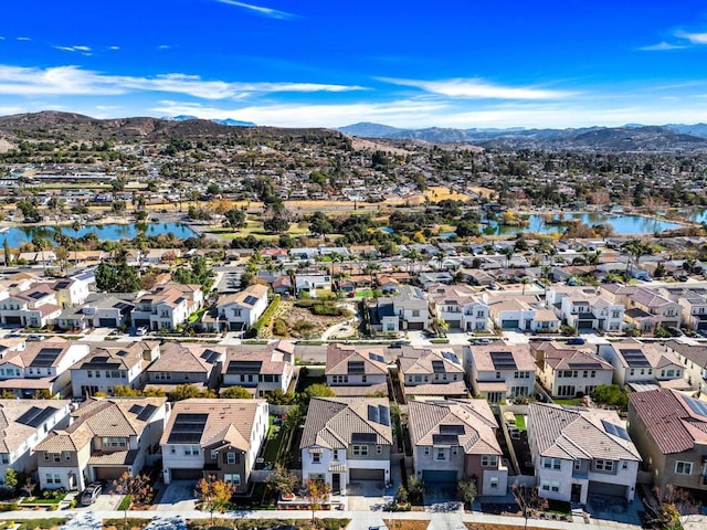 bird's eye view with a water and mountain view