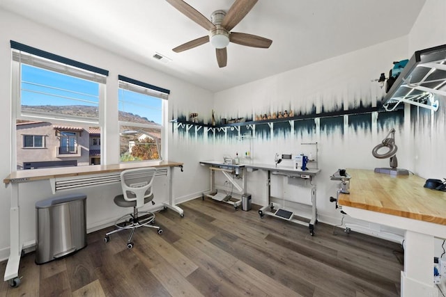 office space featuring dark hardwood / wood-style floors and ceiling fan