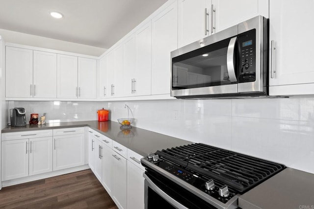 kitchen with white cabinetry, appliances with stainless steel finishes, and decorative backsplash