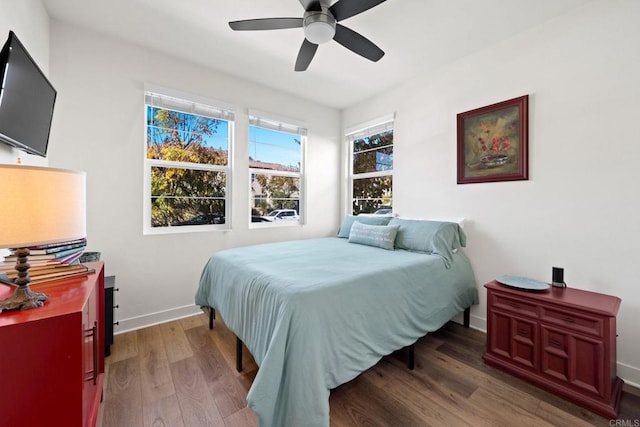 bedroom featuring dark hardwood / wood-style flooring and ceiling fan