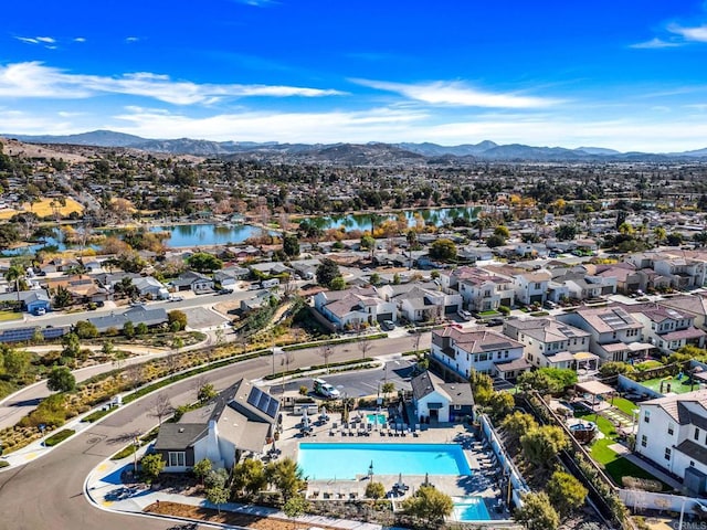 drone / aerial view featuring a water and mountain view