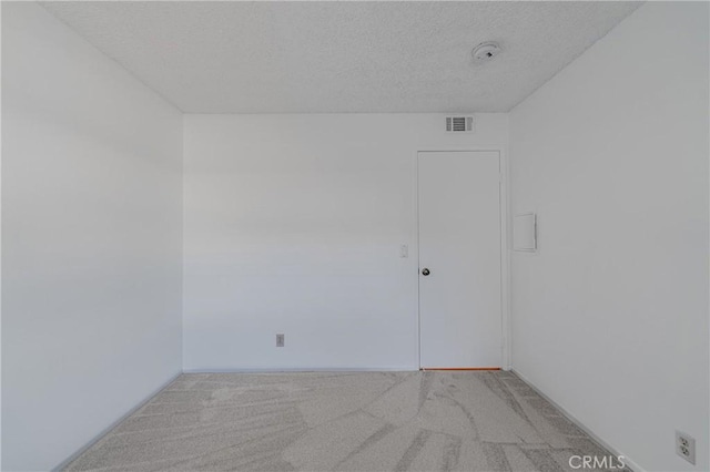 955 E 3rd St Unit 304, Long Beach, CA 90802 - empty room with a textured ceiling and light carpet