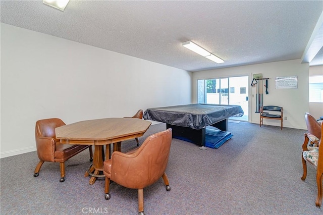 recreation room with a textured ceiling, carpet flooring, and billiards