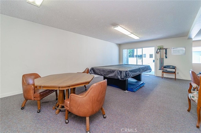rec room with pool table, carpet flooring, and a textured ceiling