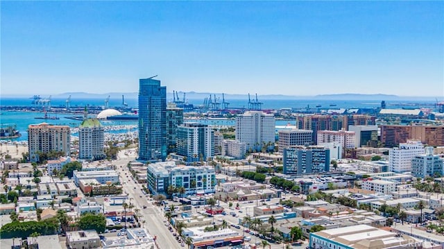 property's view of city featuring a water and mountain view