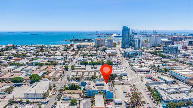 drone / aerial view with a city view and a water view
