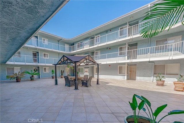 view of property's community featuring a gazebo and a patio area