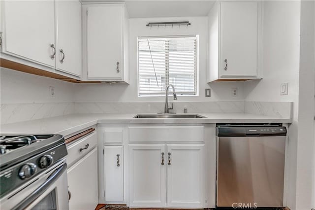 955 E 3rd St Unit 304, Long Beach, CA 90802 - kitchen featuring appliances with stainless steel finishes, a sink, and white cabinetry