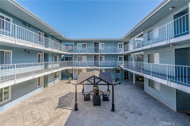 view of property's community with a patio