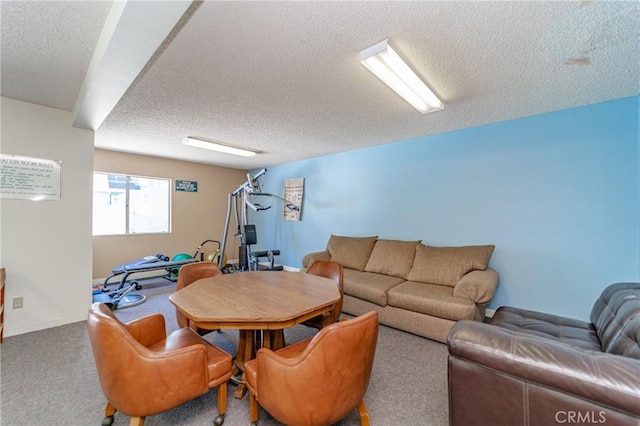 carpeted living room featuring a textured ceiling