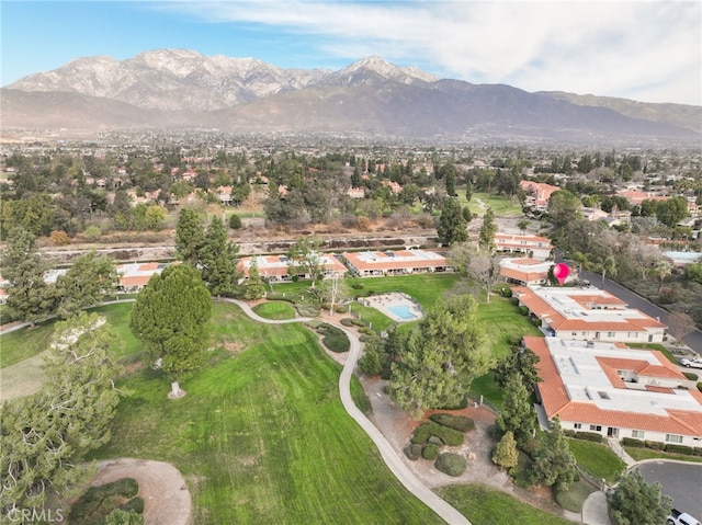 birds eye view of property featuring a mountain view