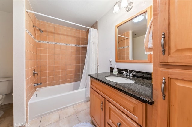 full bathroom featuring shower / bath combination with curtain, toilet, vanity, and tile patterned flooring