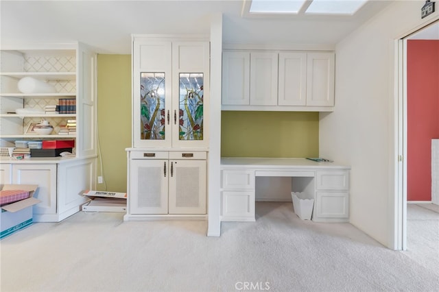 unfurnished office featuring light carpet and french doors