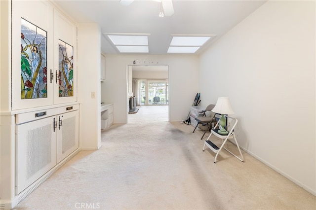 hallway featuring light carpet and french doors