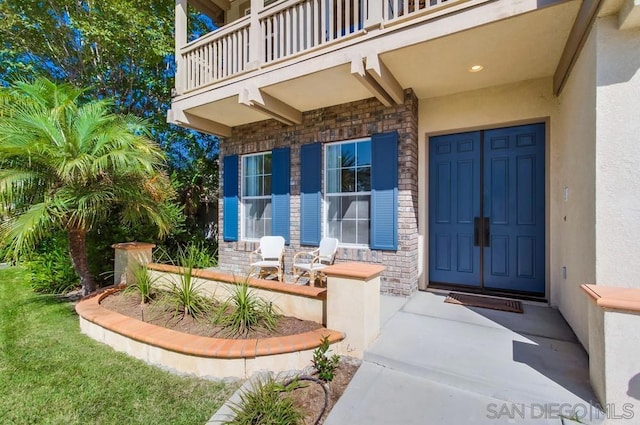 property entrance with a balcony