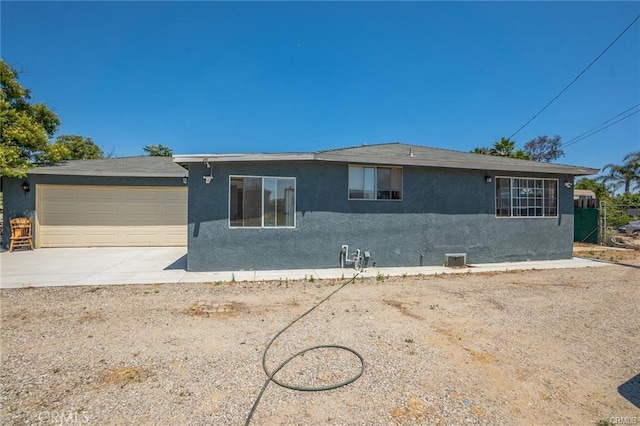 ranch-style home with a garage