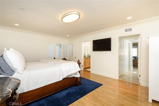 bedroom featuring ornamental molding and wood-type flooring