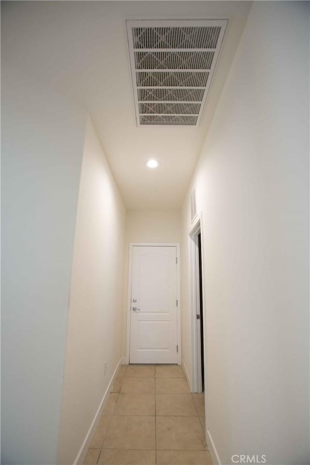 hallway featuring light tile patterned flooring