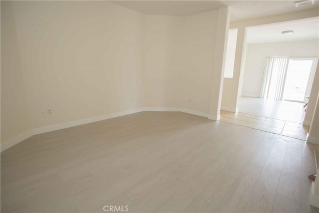 empty room featuring light hardwood / wood-style floors