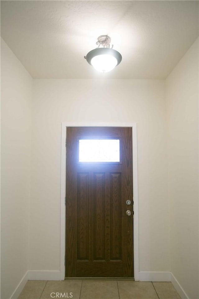 foyer with light tile patterned floors