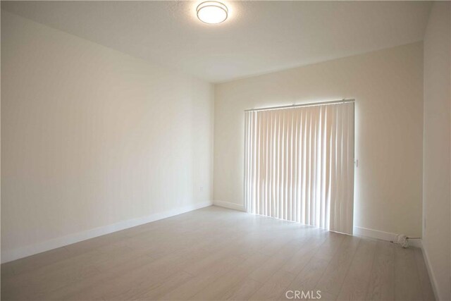 spare room featuring hardwood / wood-style floors