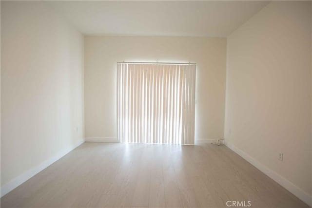 unfurnished room featuring light hardwood / wood-style flooring