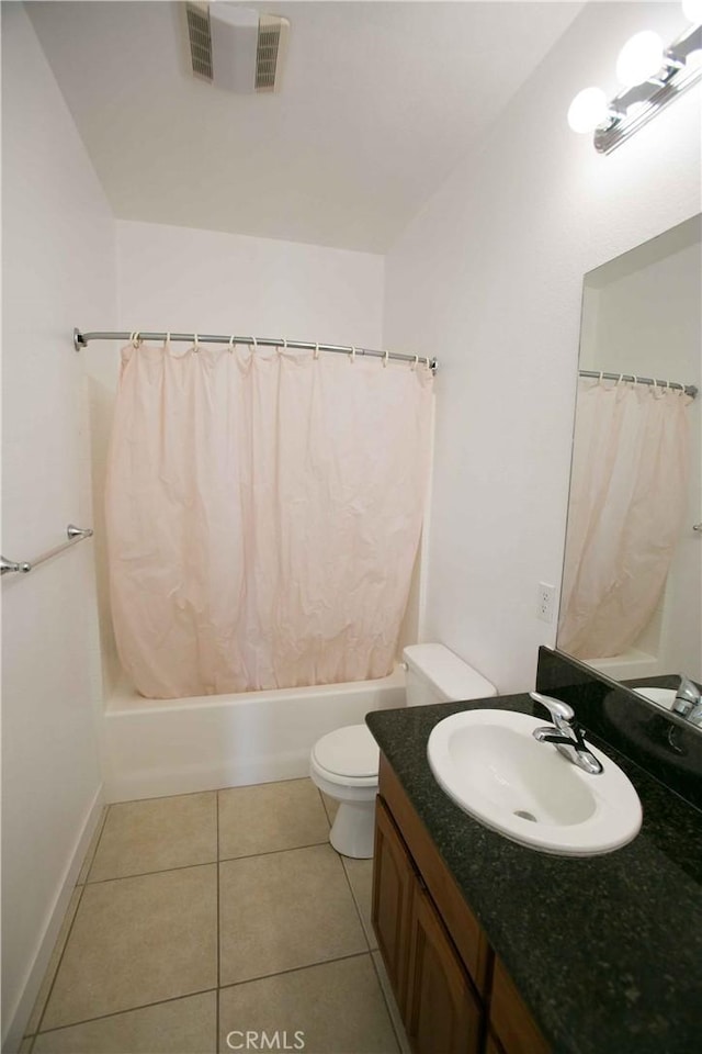 full bathroom featuring toilet, vanity, shower / tub combo with curtain, and tile patterned floors