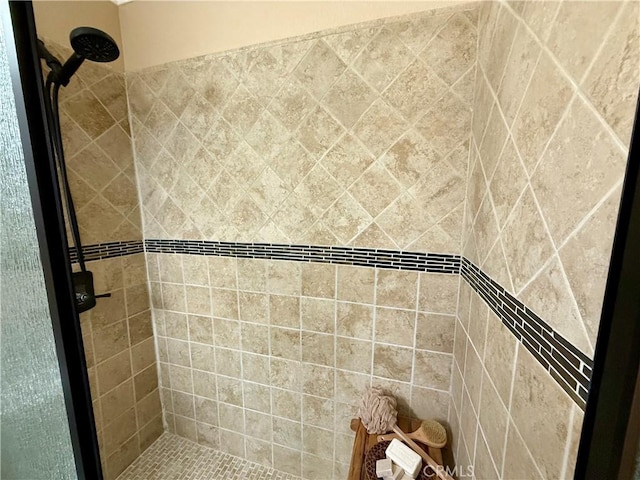 bathroom with tiled shower