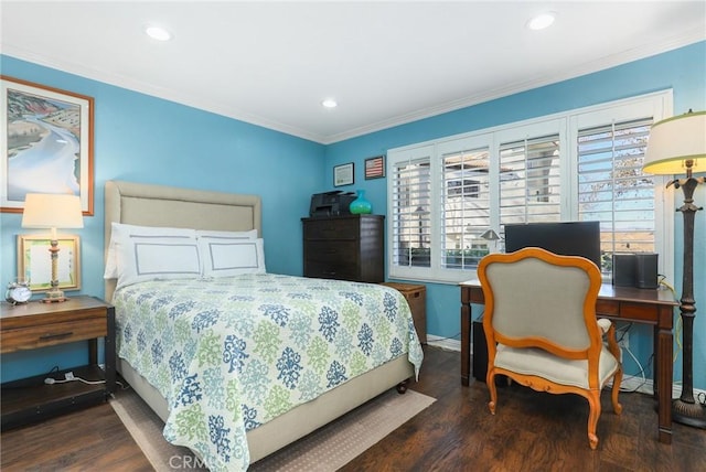 bedroom with dark hardwood / wood-style flooring and ornamental molding