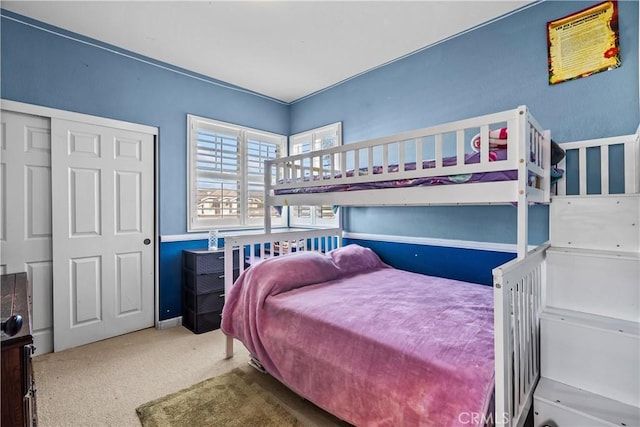 carpeted bedroom with a closet