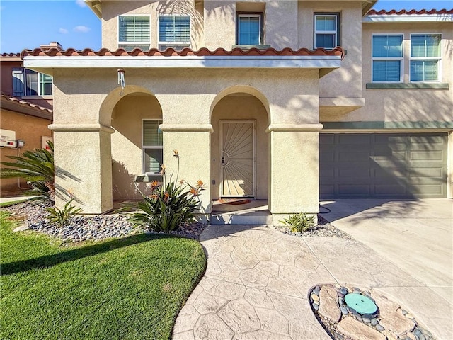 doorway to property with a garage