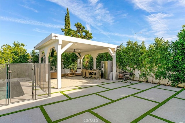 view of patio / terrace featuring ceiling fan and an outdoor living space