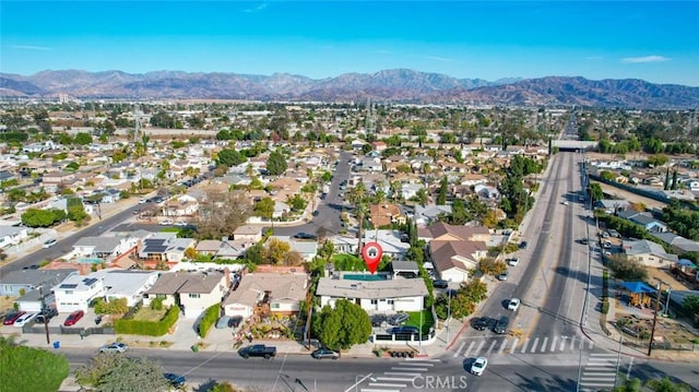 drone / aerial view featuring a mountain view