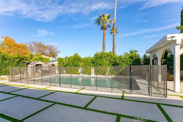 view of swimming pool with a patio area