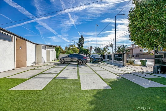 view of car parking featuring a yard